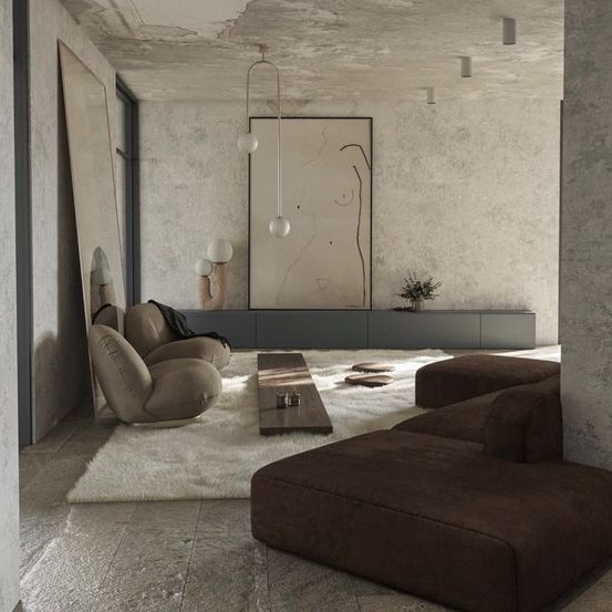 Salon moderne avec canapés en tissu brun et tapis clair, éclairage minimaliste.
